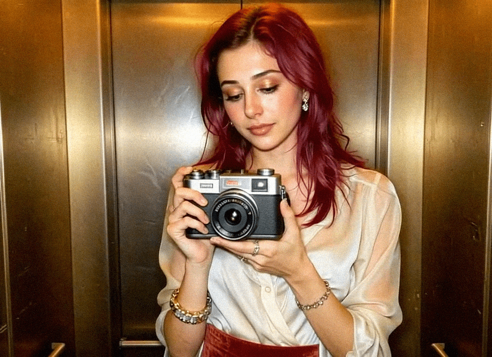 Emma-Jane MacKinnon-Lee, taking a selfie in the elevator